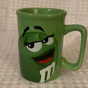 M&M’s green mug, 4.5 inches tall.